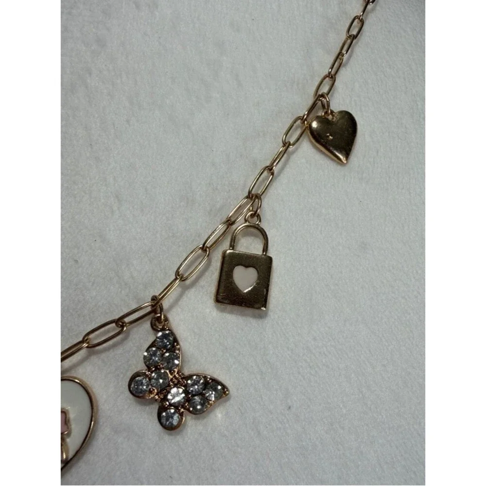 Packed Party Gold-Tone Heart & Charm Necklace with Pink Bow Accent